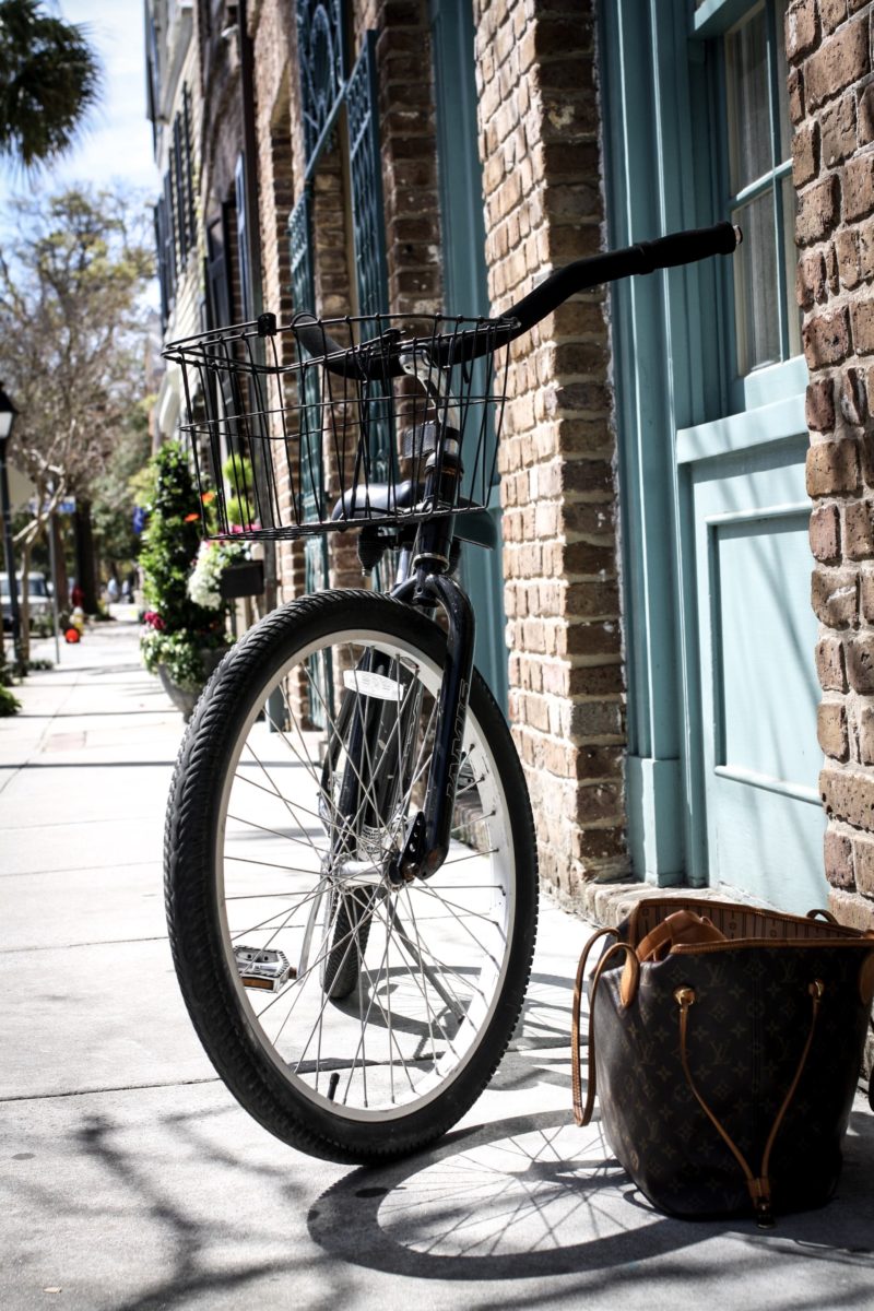 Touring Charleston by bike in the perfect denim top. Read more to see how I styled this top two ways.