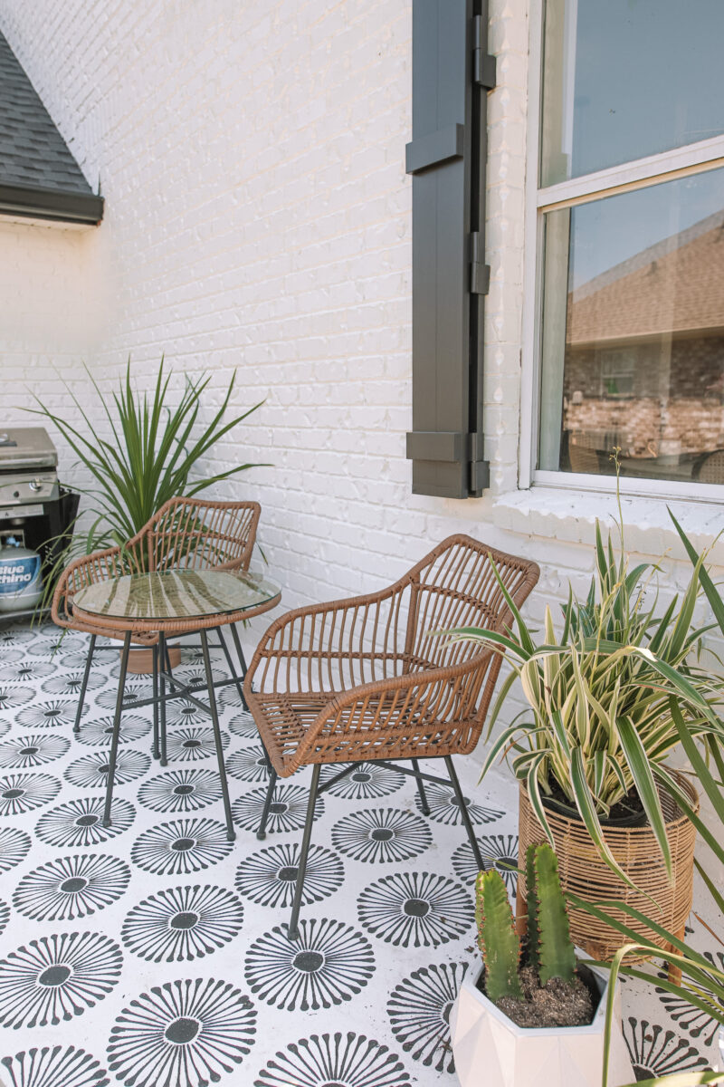 How to give your backyard a complete makeover on a budget. How to stencil your back patio and style it with ease!! Step by step on the blog.